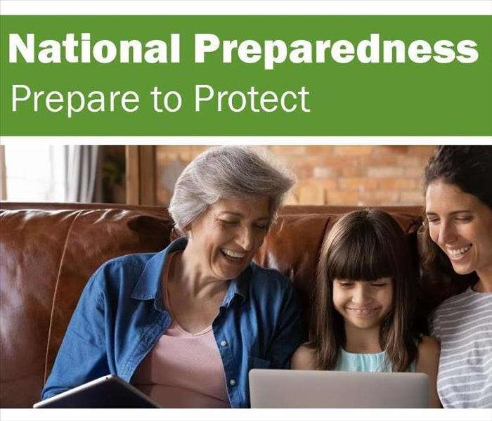 National Preparedness Month 2021 text and three smiling faces looking at a computer