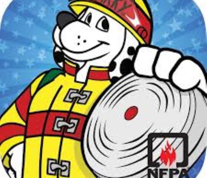 Sparky the fire dog holding a smoke alarm, NFPA logo